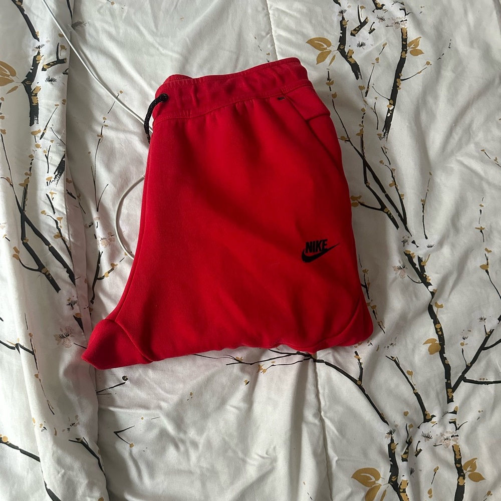 Red Nike tech pants size medium